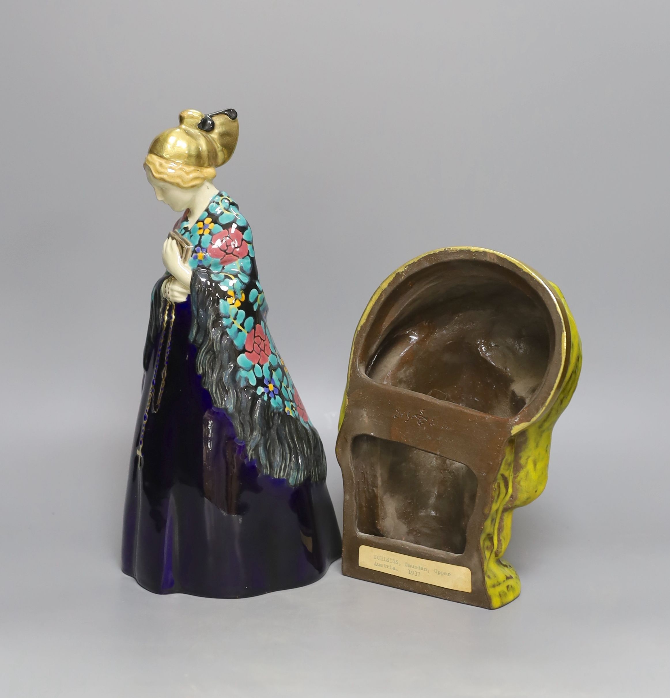 Emilie Schleiss (1880-1962), two ceramic figures including a wall mask and church goer figure